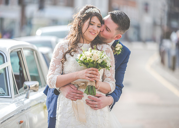 Surrey wedding photographer- westerham golf club wedding- bride groom by car