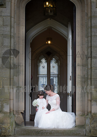 Surrey Wedding Photographer- Chiddingstone Castle- bride and bridesmaid in archway