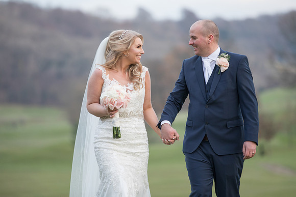 Surrey wedding photographer / woldingham golf club wedding / holding hands 01