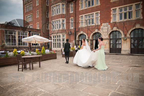 Surrey wedding photographer / selsdon park hotel wedding bride on her way inside 30
