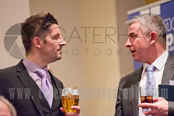 surrey event photographer- two men having a conversation- at business meeting