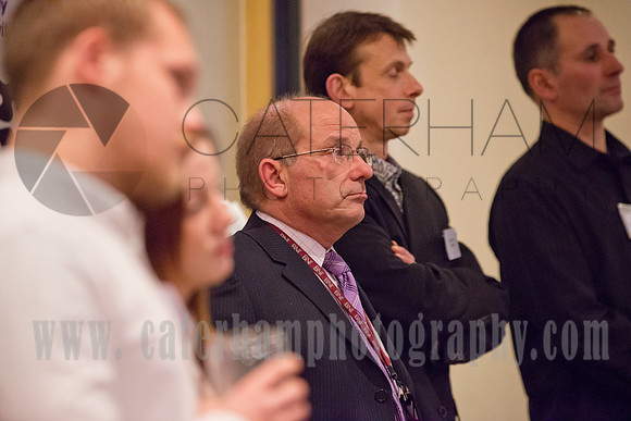 Surrey event photographer -BNI event- man listening to speech