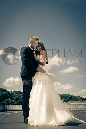 surrey wedding photographer- Fashion Wedding Photography- bride and groom hugging
